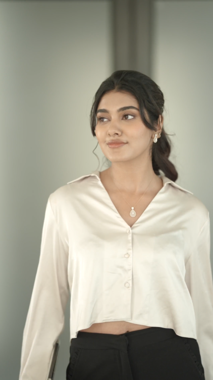 A Suman Jewellery diamond pendant worn by a model